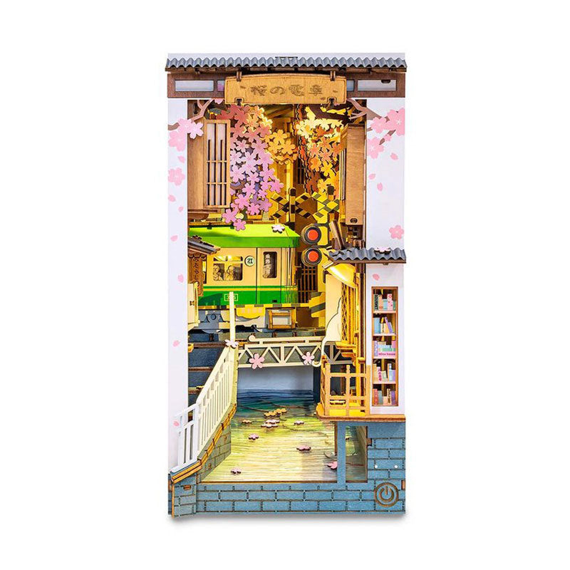 Take a delightful journey on a Japanese train and wander through Tokyo streets in full spring bloom with this beautiful DIY book nook kit.
Pieces: 340
Assembly Time: ~6 hours
Difficulty Level: ⭐⭐⭐⭐
Assembled Size: H: 7.5″ (19cm) × W: 4.7″ (12cm) × D: 8.7″ (22cm)