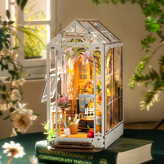 Capture the charm of a sunny morning surrounded by blooming flowers with this enchanting Garden House book nook. The elegant arched doorway and dark, textured glass give it a timeless, nostalgic feel, while the sweeping curved staircase adds sophistication to this miniature scene. A perfect blend of beauty and serenity for your bookshelf or display.

Pieces: 176
Assembly Time: ~5 hours
Difficulty Level: ⭐⭐⭐⭐
Assembled Size: H: 9.5″ (24.1cm) × W: 4.3″ (11cm) × D: 8″ (20.3cm)