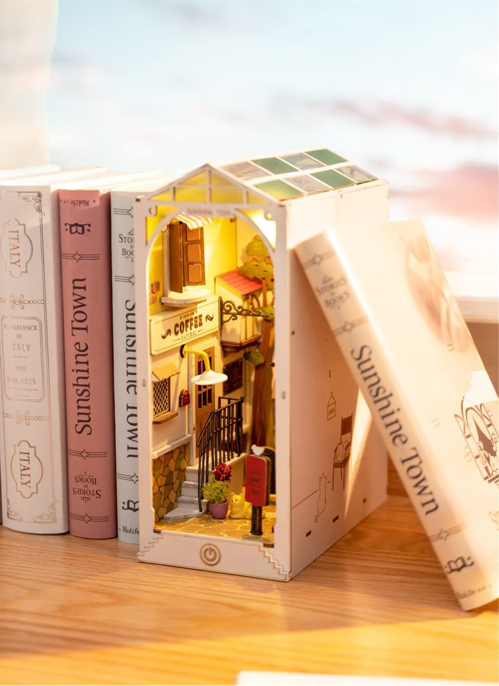 Discover the charm of Sunshine Town! Build your own cozy miniature world featuring a coffee shop, bookstore, and more—an enchanting DIY book nook for your shelf.

Pieces: 246
Assembly Time: 4–6 hours
Difficulty Level: ⭐⭐⭐⭐
Assembled Size: H: 7.5″ (19cm) × W: 3.9″ (10cm) × D: 9.4″ (24cm)